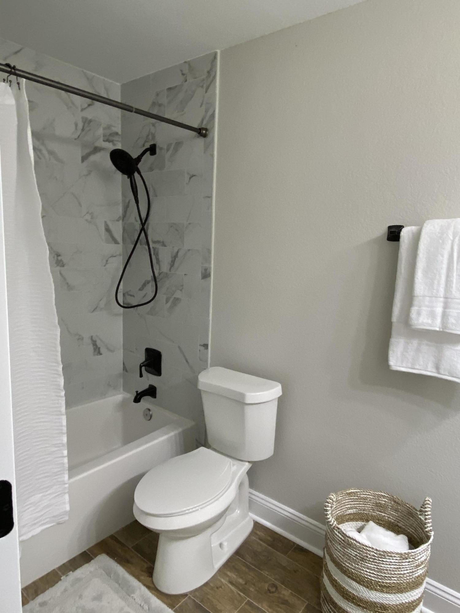 321 St Andrews Drive Niceville, FL 32578 - Photo 11 of 15 a white toilet sitting next to a bath tub and a shower