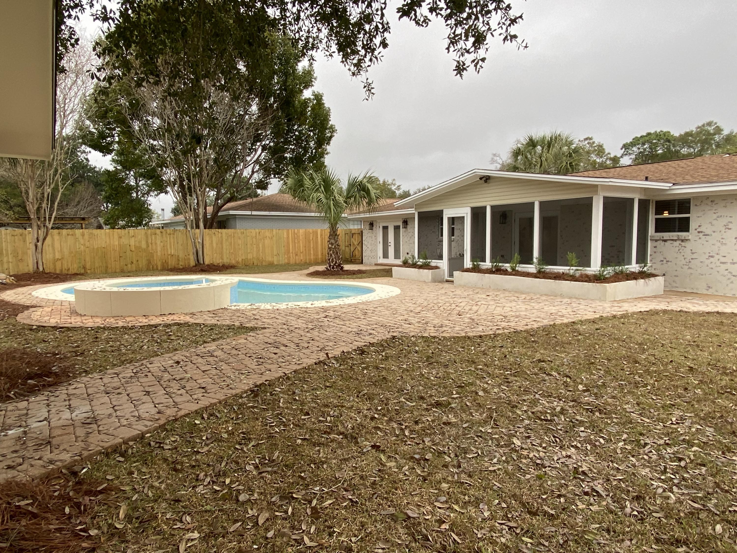 321 St Andrews Drive Niceville, FL 32578 - Photo 14 of 15 a front view of a house with a yard