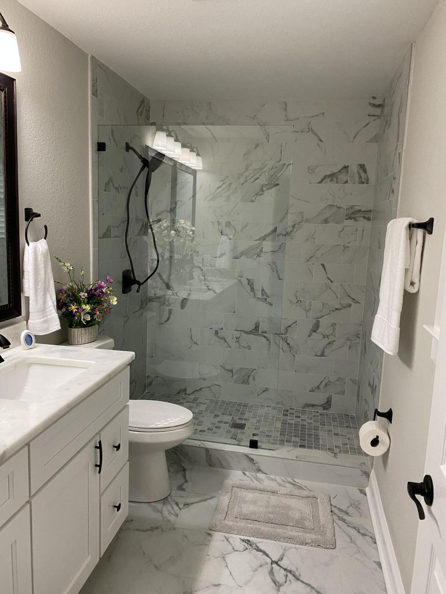 321 St Andrews Drive Niceville, FL 32578 - Photo 10 of 15 a bathroom with a granite countertop sink a toilet and shower