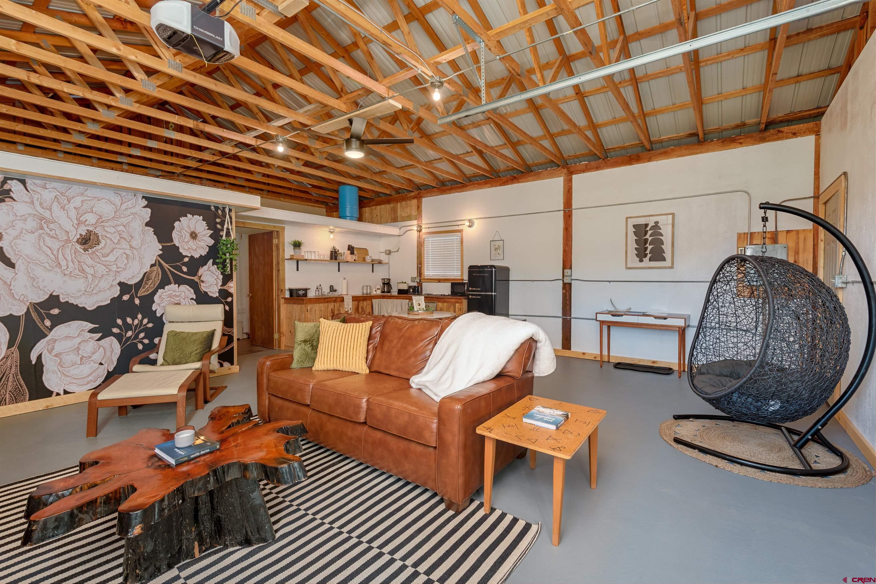 11531 4050th Road Paonia, CO 81428 - Photo 11 of 37 a living room with furniture a rug and a window