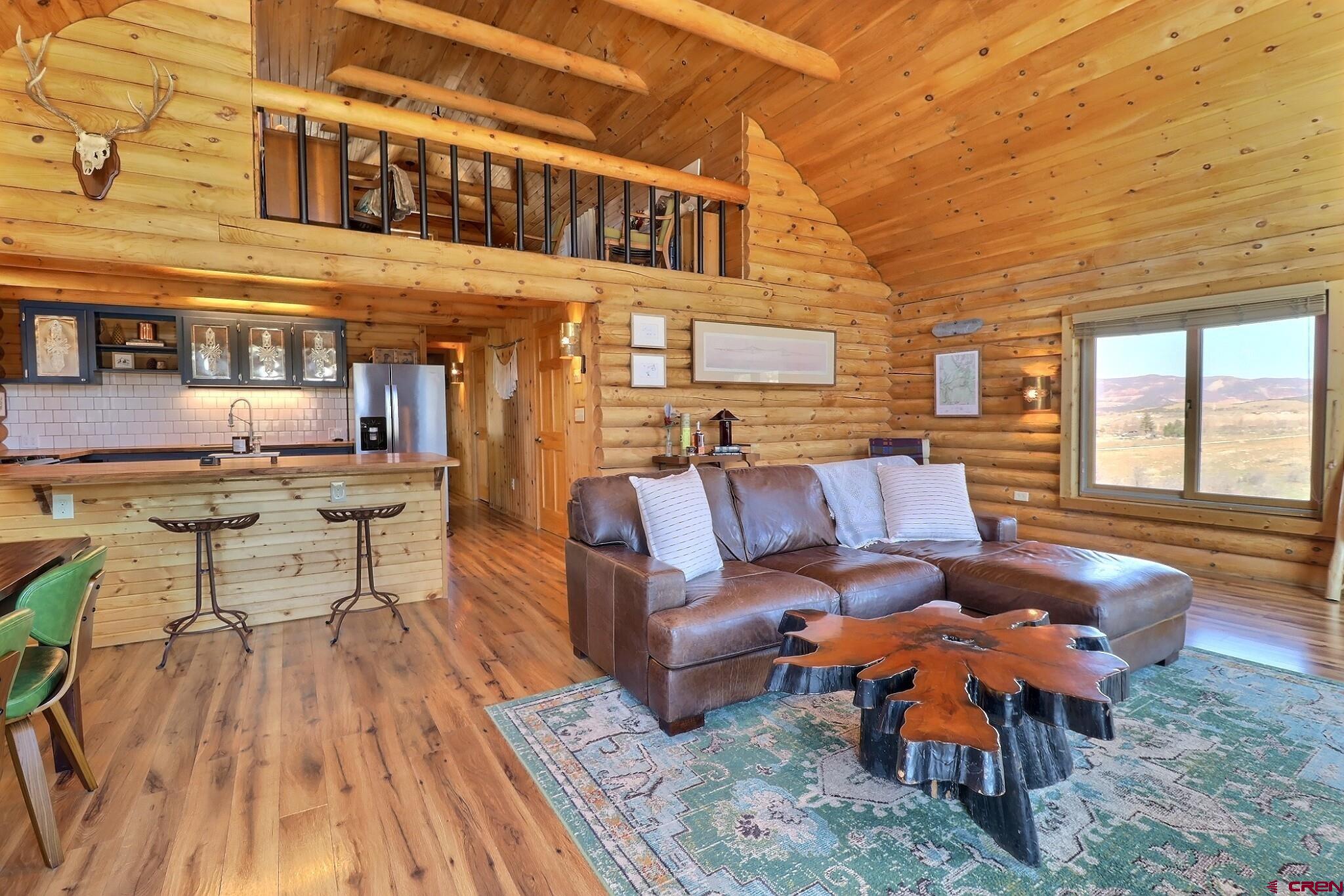 11531 4050th Road Paonia, CO 81428 - Photo 21 of 37 a outdoor space with patio the couches and a dining table with chairs