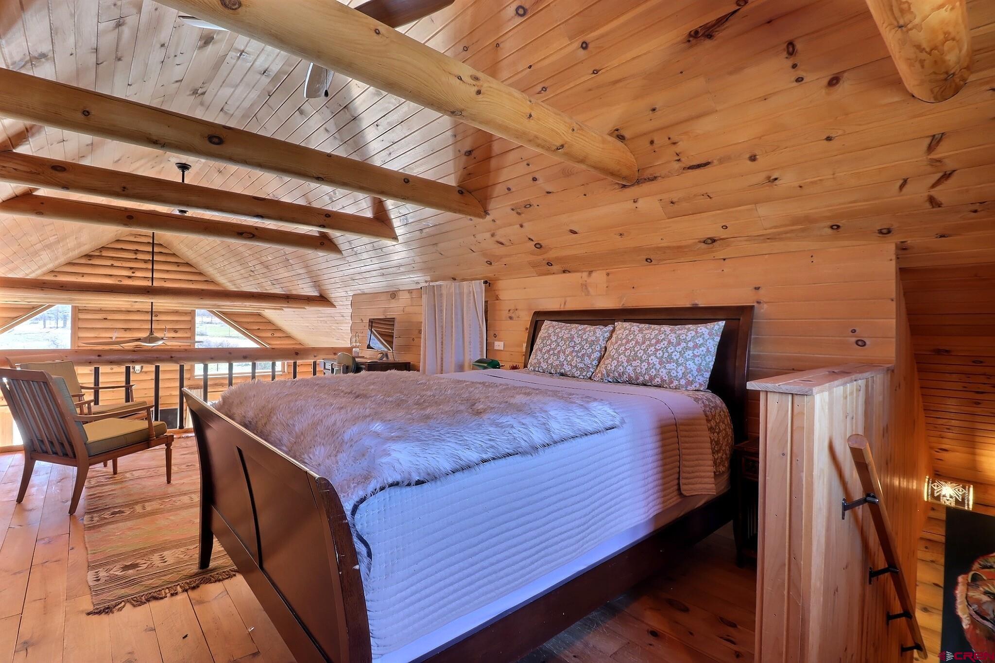 11531 4050th Road Paonia, CO 81428 - Photo 25 of 37 a bed sitting in a bedroom next to a window