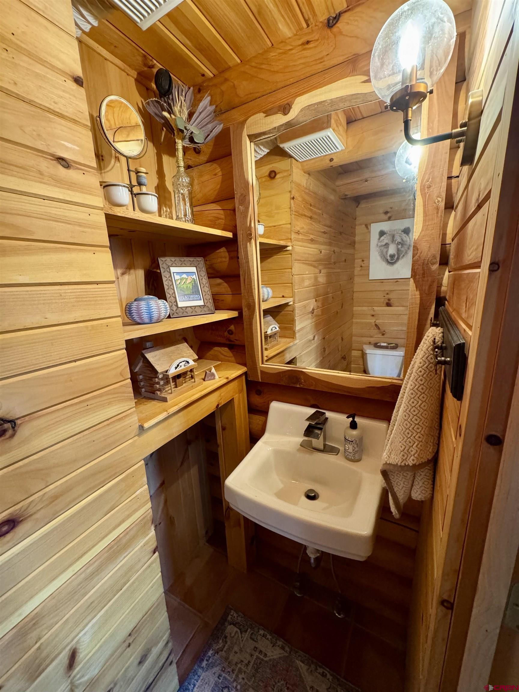 11531 4050th Road Paonia, CO 81428 - Photo 29 of 37 a bathroom with a sink and a mirror