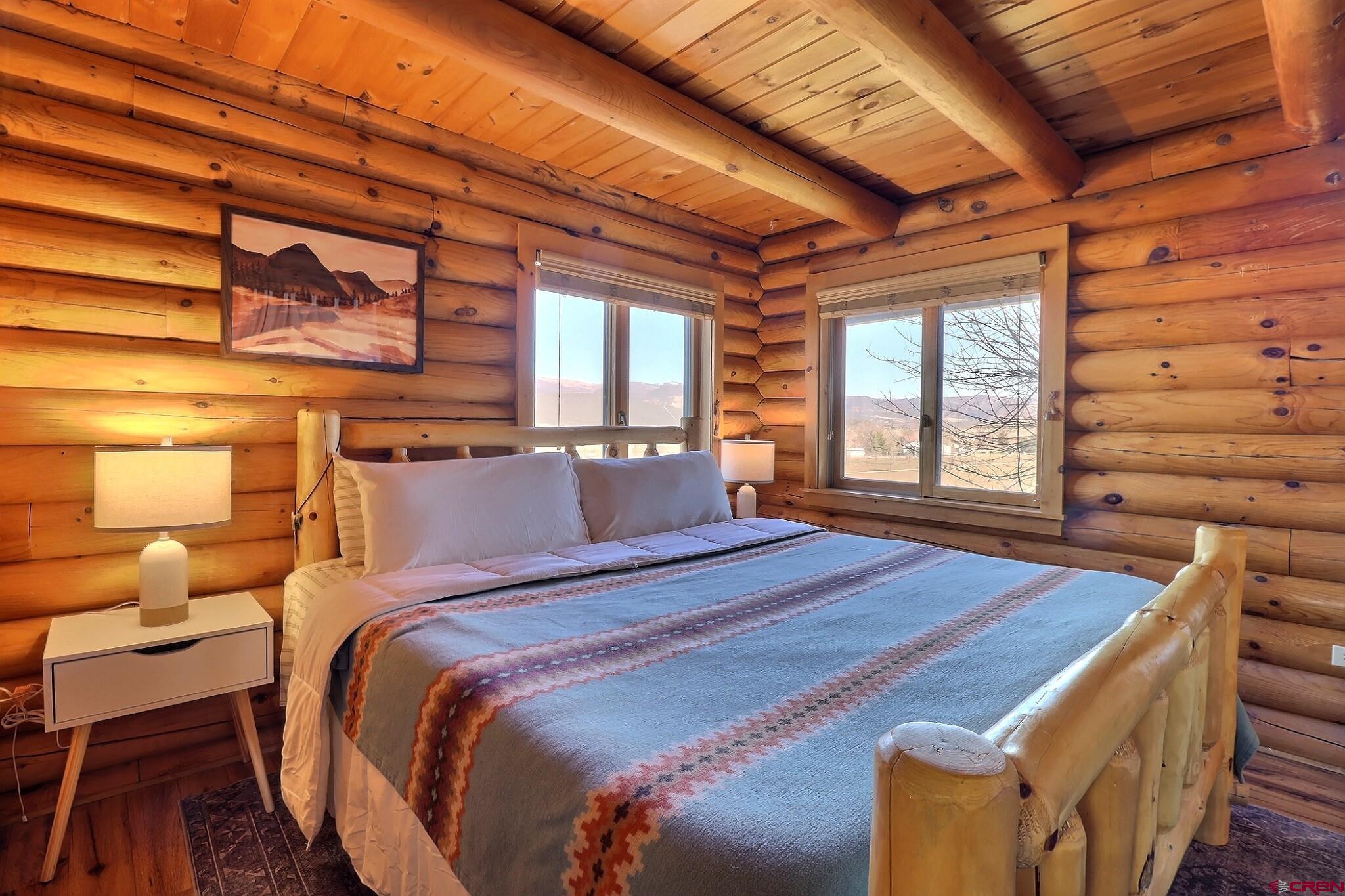 11531 4050th Road Paonia, CO 81428 - Photo 6 of 37 a bedroom with a bed next to a window