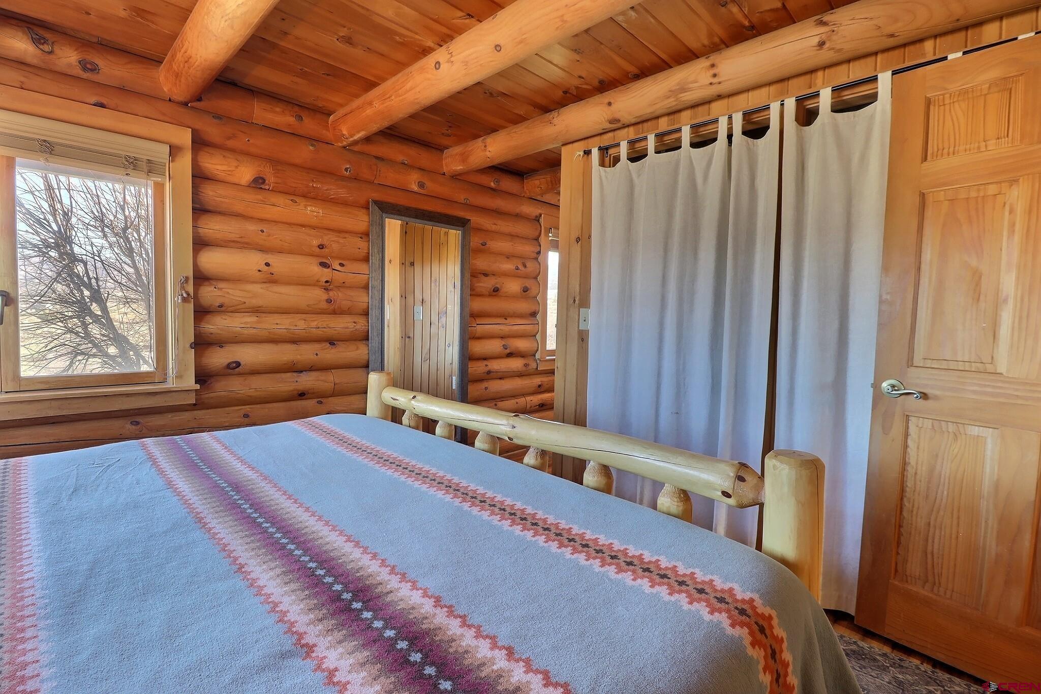 11531 4050th Road Paonia, CO 81428 - Photo 7 of 37 a bedroom with a bed and a window