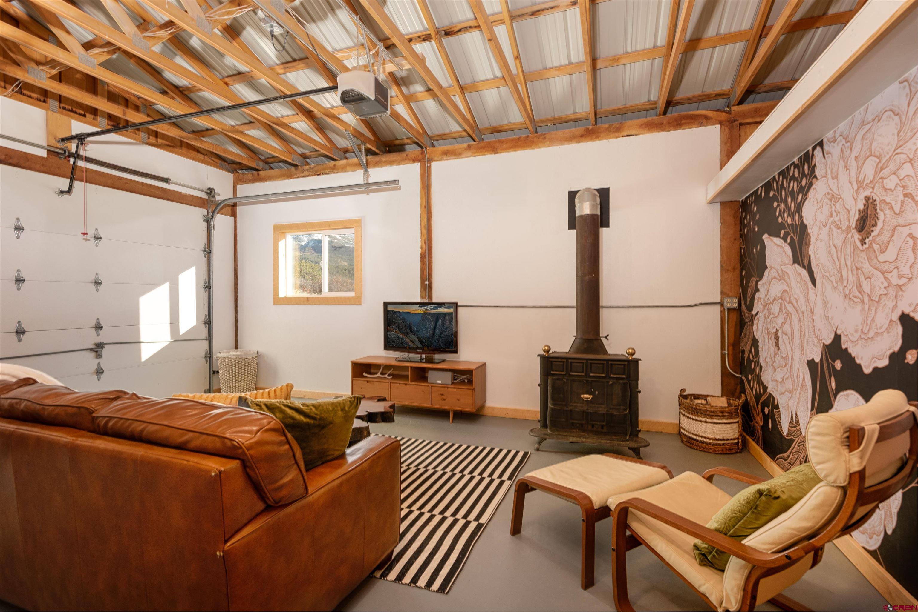 11531 4050th Road Paonia, CO 81428 - Photo 9 of 37 a bed room with a bed and a couch