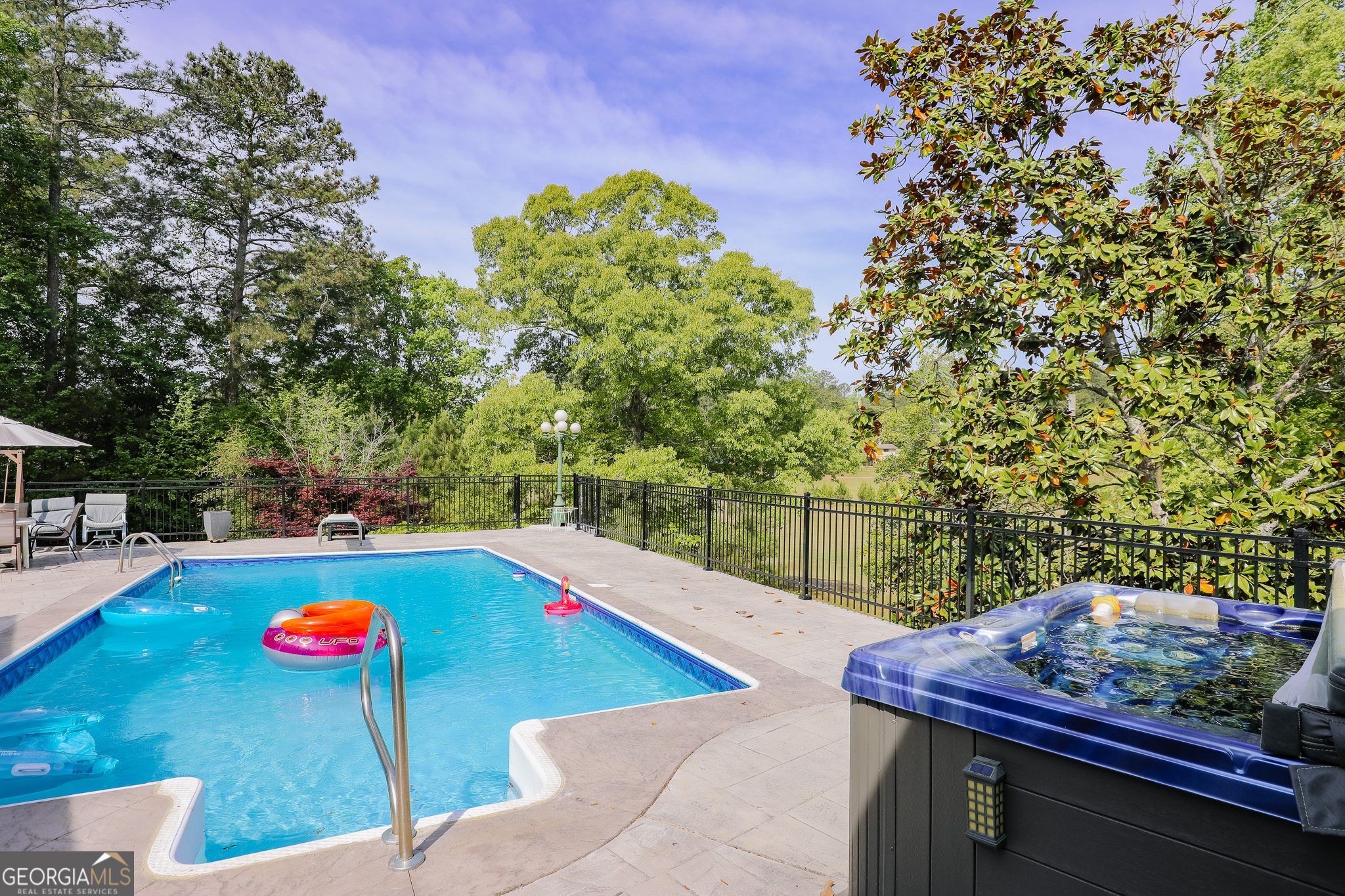 7404 Golfers Point Villa Rica, GA 30180 - Photo 13 of 21 a view of a backyard with swimming pool