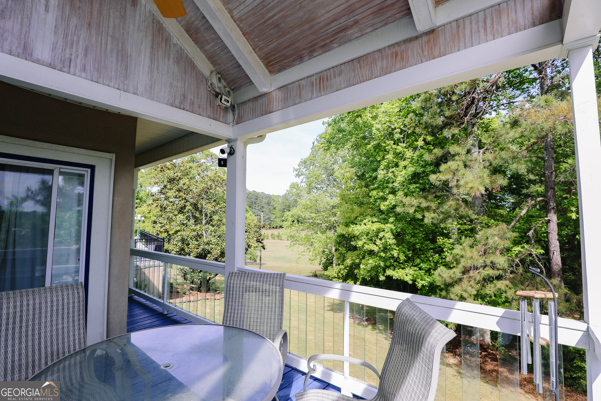 7404 Golfers Point Villa Rica, GA 30180 - Photo 17 of 21 a view of a porch with furniture and a yard