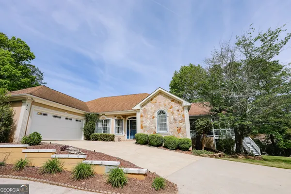 a front view of a house with a yard