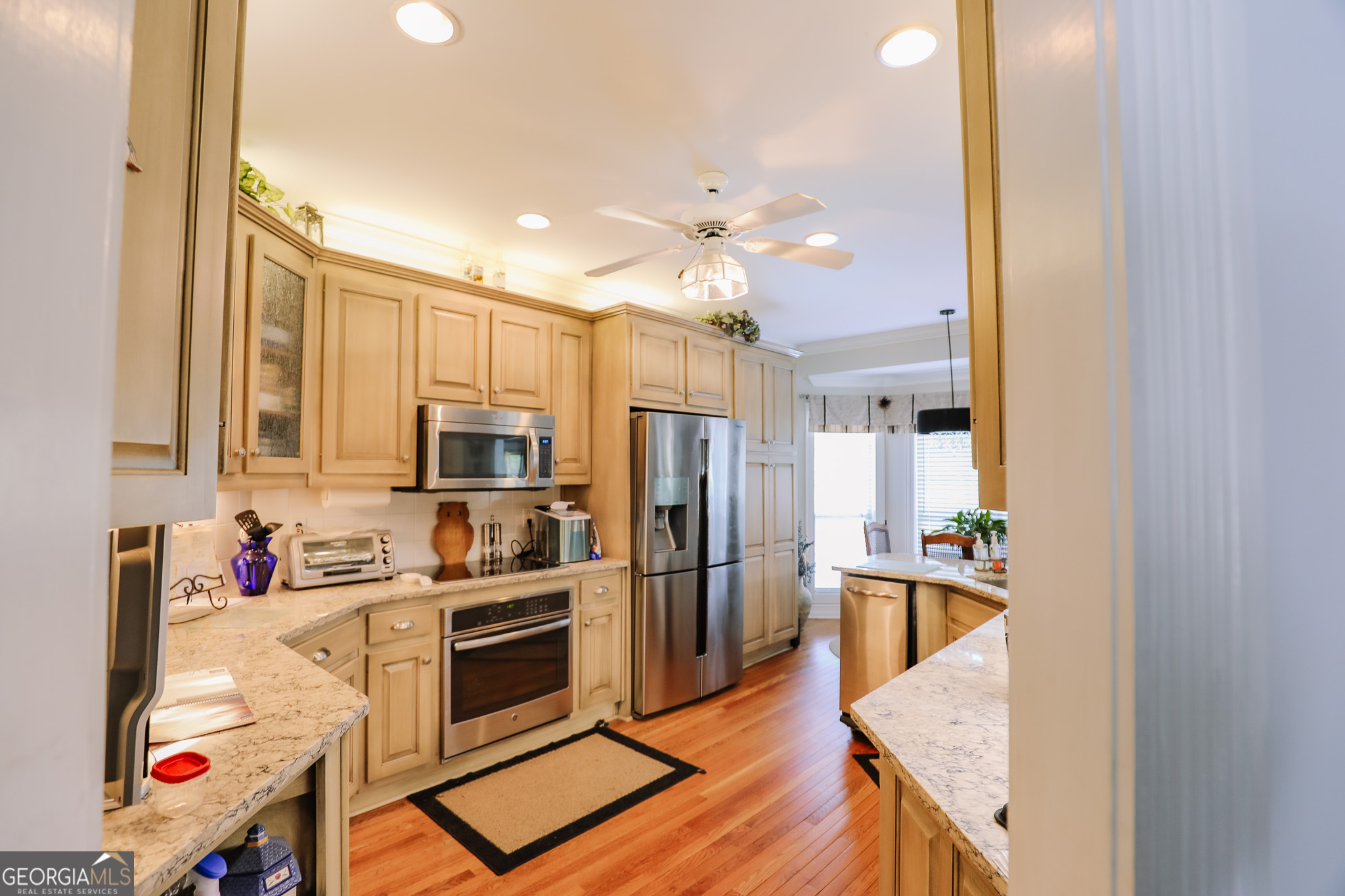 7404 Golfers Point Villa Rica, GA 30180 - Photo 6 of 21 a kitchen with stainless steel appliances and chandelier