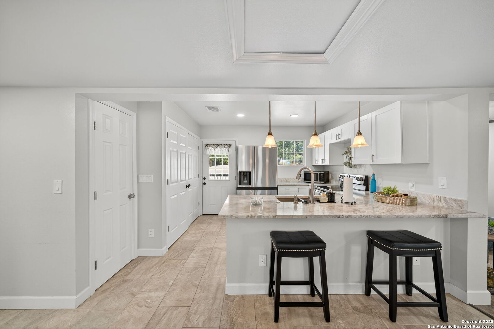 974 South Addison Street San Antonio, TX 78264 - Photo 13 of 37 a kitchen with stainless steel appliances kitchen island granite countertop a sink and cabinets