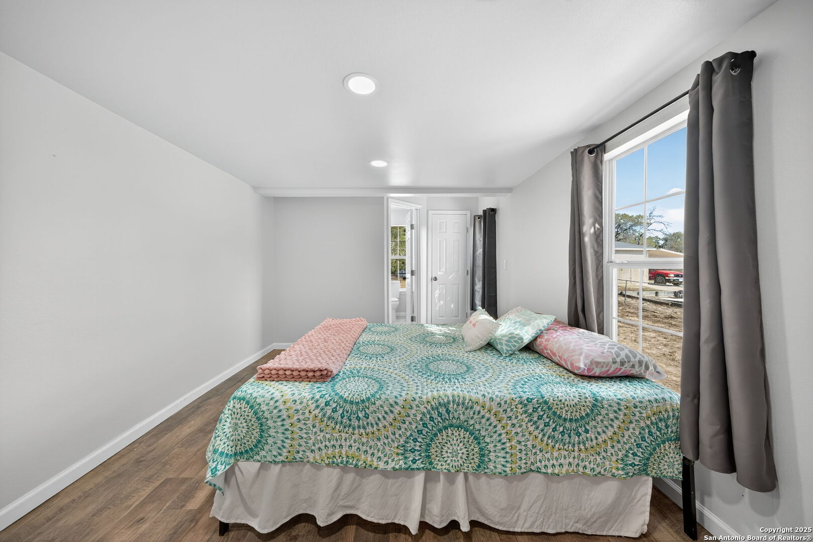 974 South Addison Street San Antonio, TX 78264 - Photo 19 of 37 a bedroom with a bed and dresser