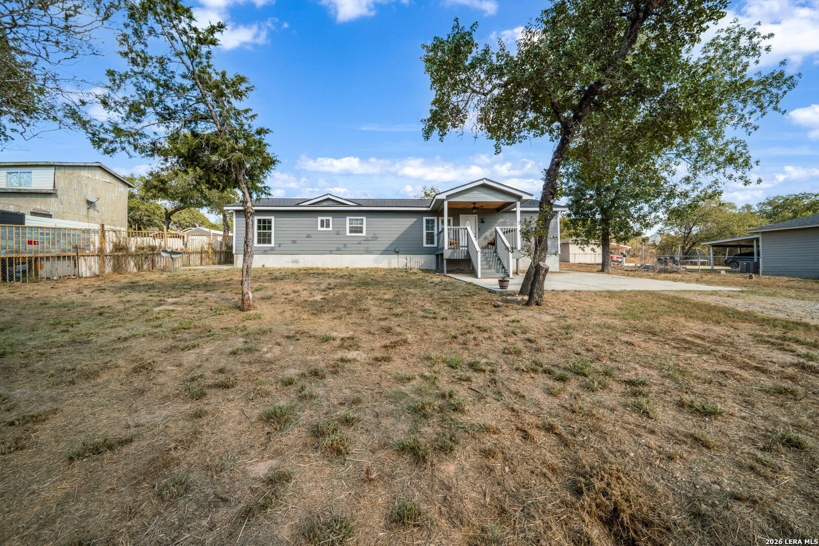 974 South Addison Street San Antonio, TX 78264 - Photo 2 of 37 a front view of a house with a yard