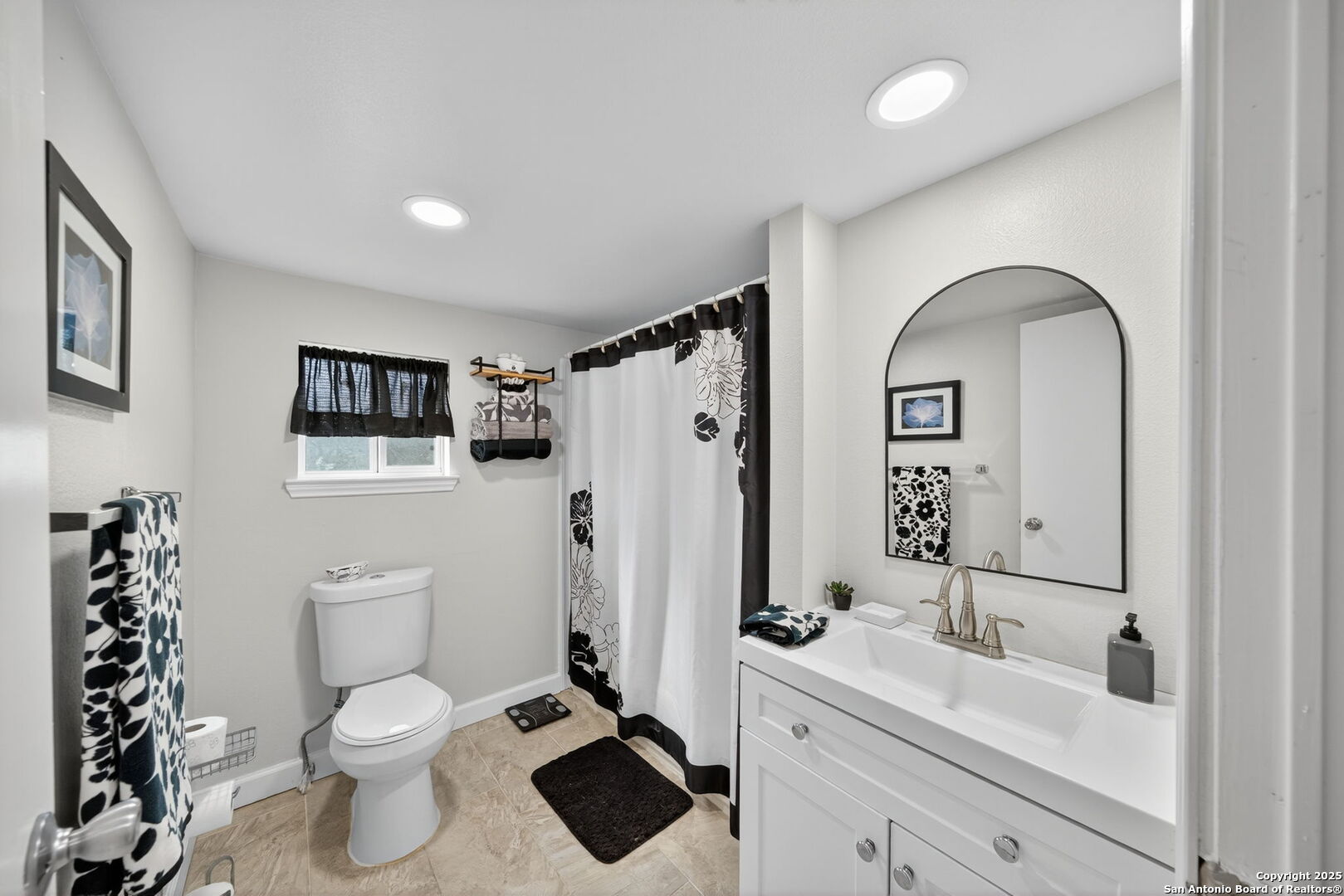 974 South Addison Street San Antonio, TX 78264 - Photo 22 of 37 a bathroom with a sink a toilet and a mirror