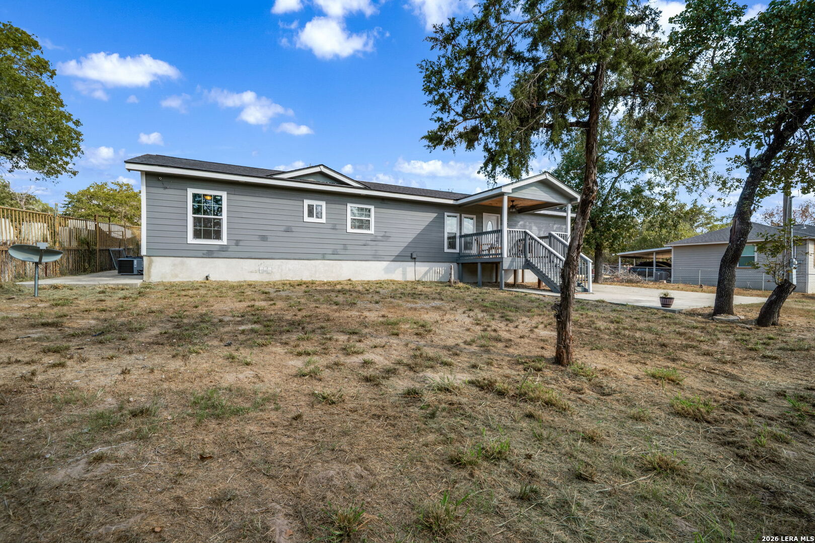 974 South Addison Street San Antonio, TX 78264 - Photo 6 of 37 a house that has a tree in front of it