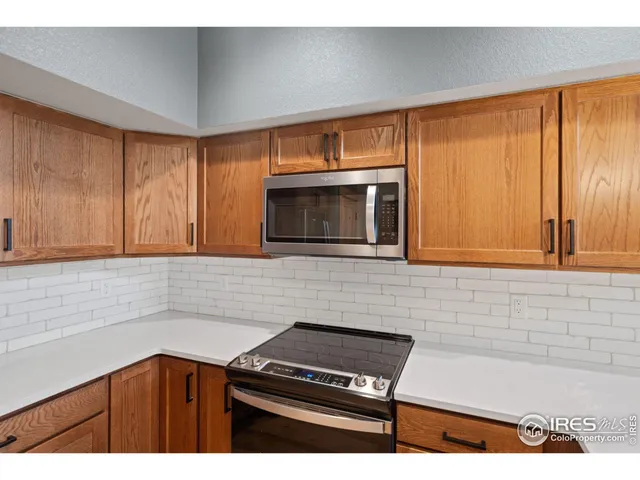 a kitchen with a stove and a microwave