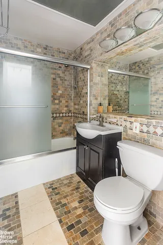 a kitchen with stainless steel appliances granite countertop a stove and a refrigerator