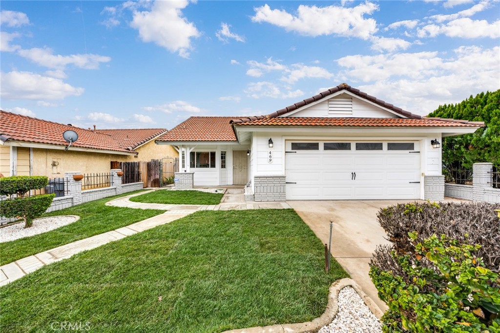 469 Aspen Lane Perris, CA 92570 - Photo 1 of 1 a front view of a house with a yard