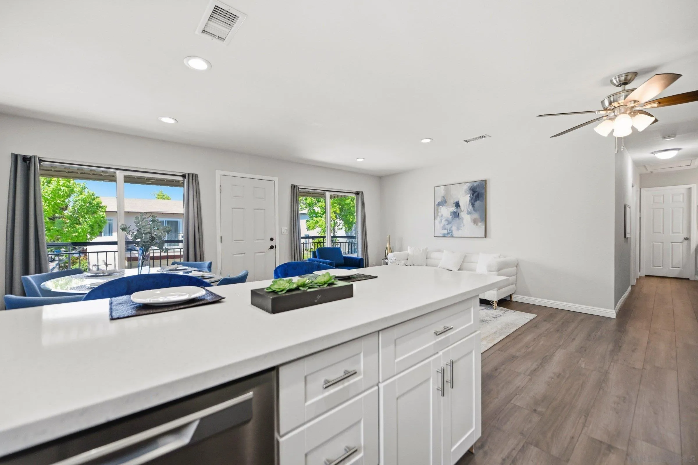 13884 Via Rimini San Diego, CA 92129 - Photo 15 of 24 a view of a center kitchen sink and living room