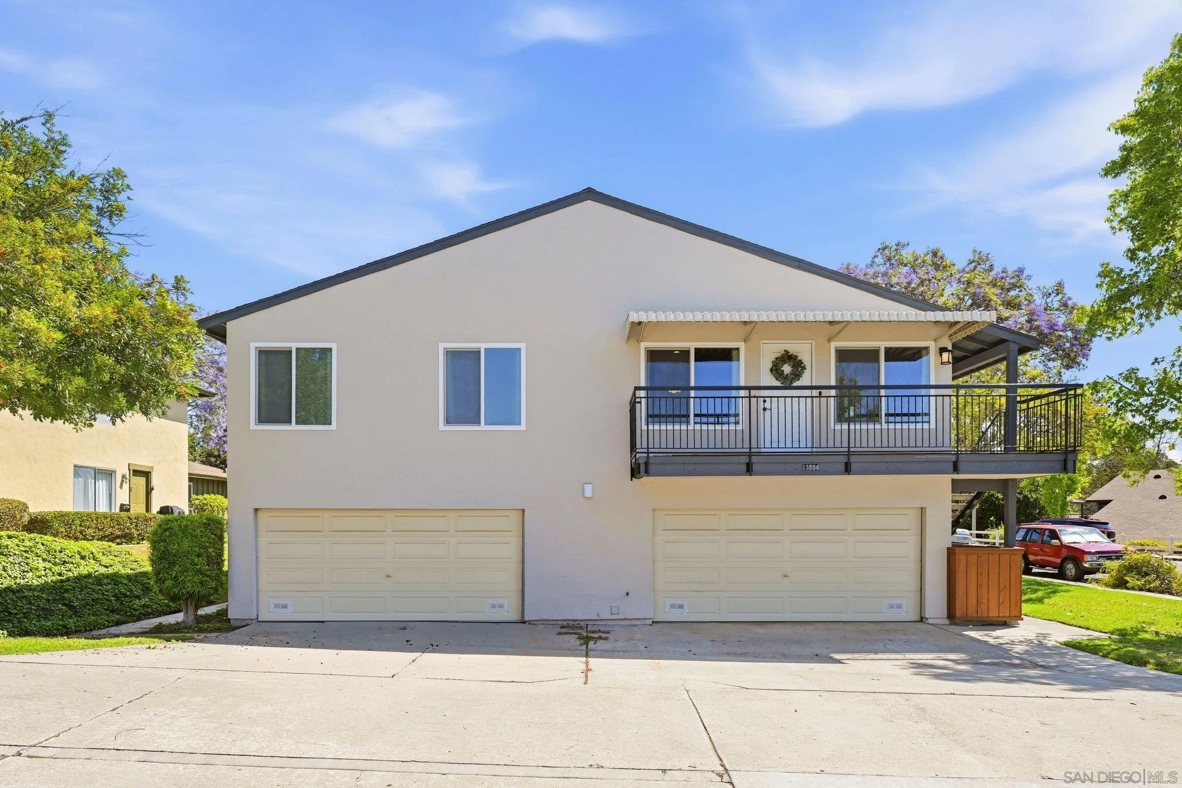 13884 Via Rimini San Diego, CA 92129 - Photo 2 of 24 a view of a house with a garden