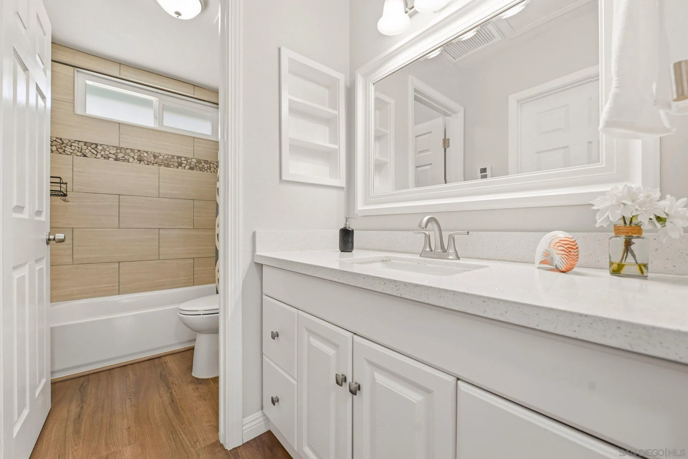 13884 Via Rimini San Diego, CA 92129 - Photo 22 of 24 a bathroom with a sink a toilet and shower