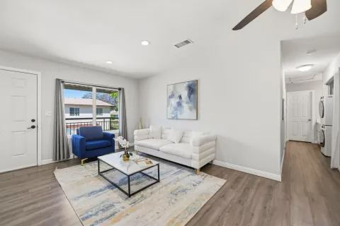 a living room with furniture and a window