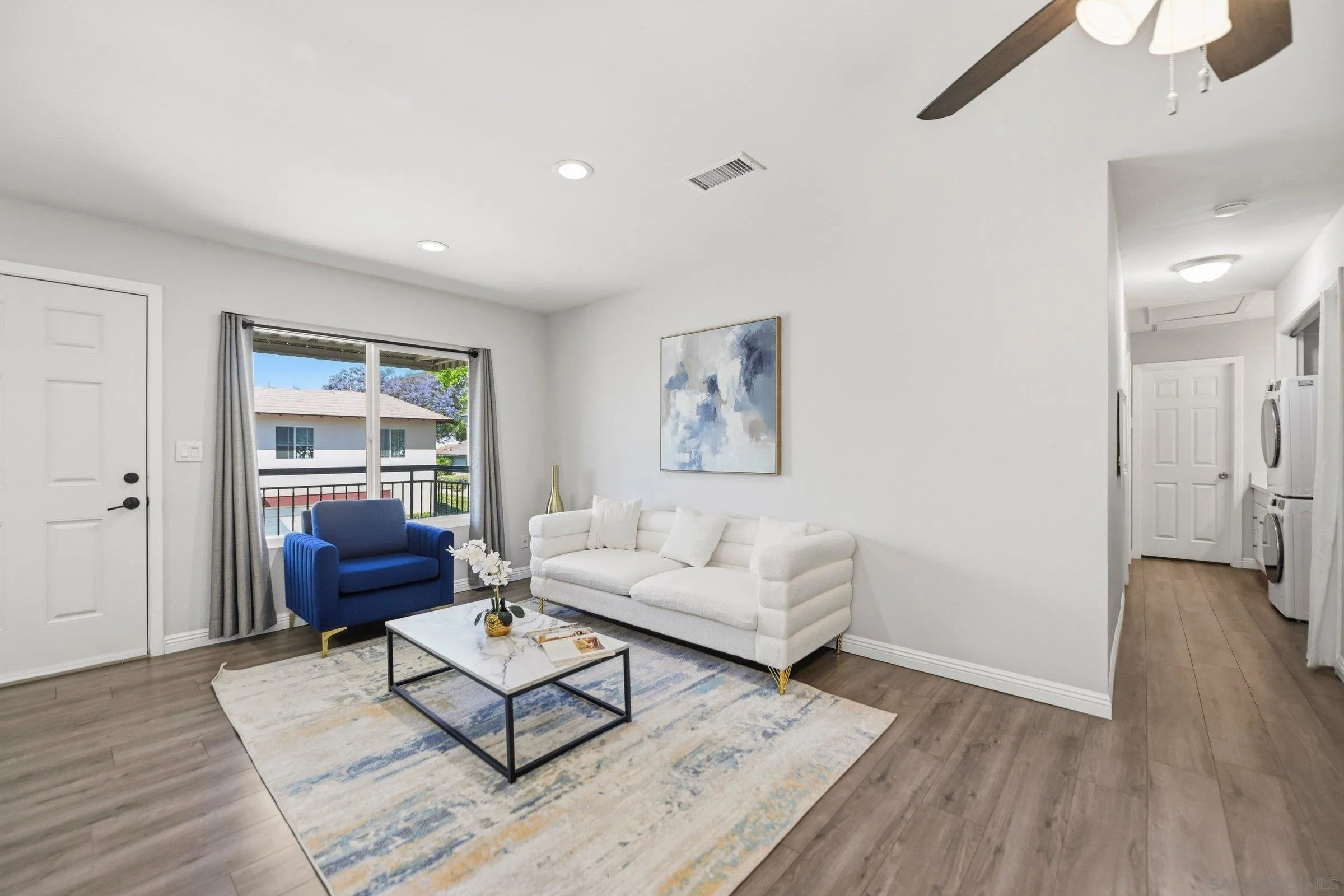 13884 Via Rimini San Diego, CA 92129 - Photo 8 of 24 a living room with furniture and a window