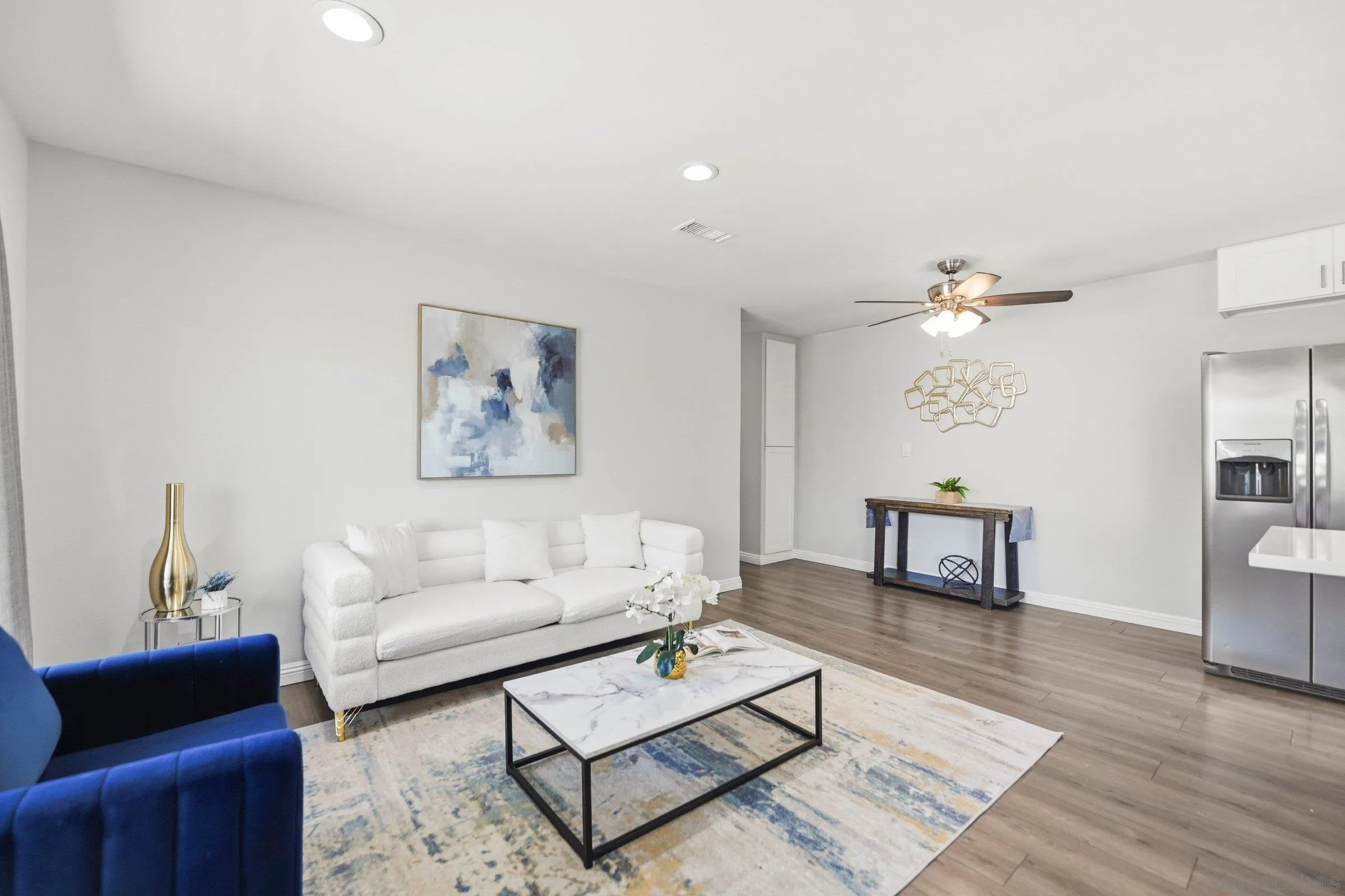 13884 Via Rimini San Diego, CA 92129 - Photo 9 of 24 a living room with furniture and a table