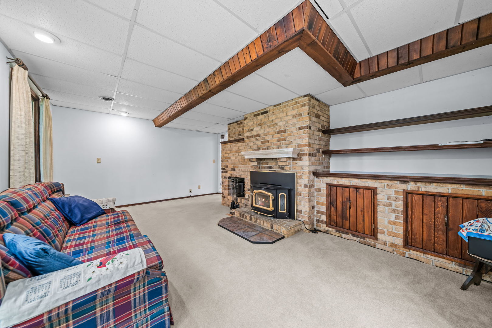 5748 South Skare Road Rochelle, IL 61068 - Photo 25 of 45 a living room with furniture and a fireplace
