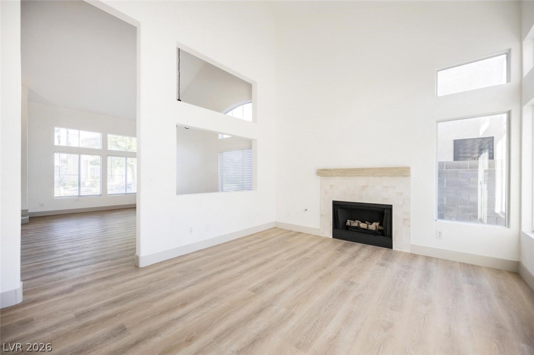 2651 Ridgewater Circle Henderson, NV 89074 - Photo 12 of 27 This airy living space features abundant natural light, high ceilings, and a cozy fireplace, perfect for relaxation.