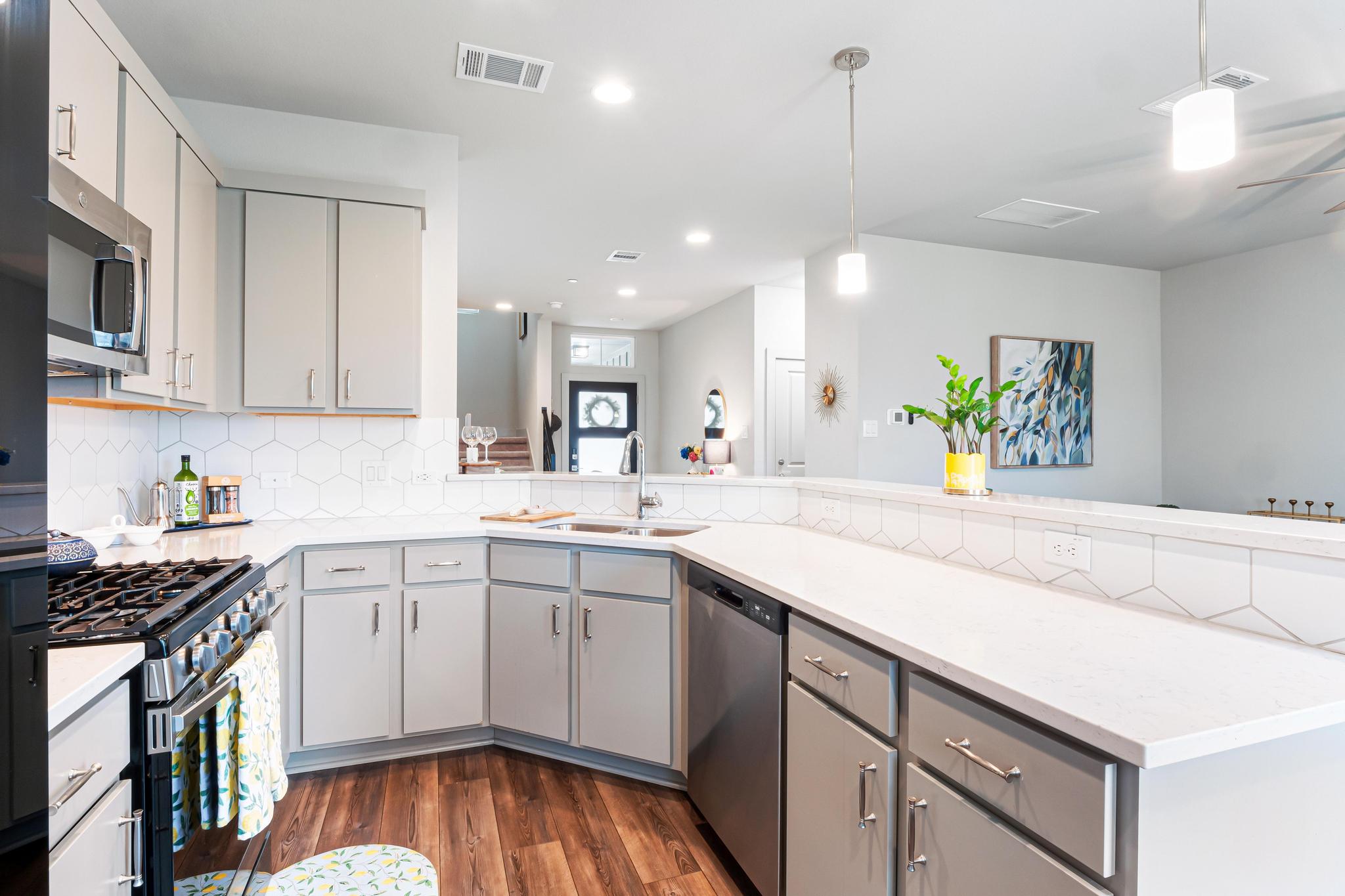2301 Local Rebel Street Leander, TX 78641 - Photo 11 of 21 a kitchen with a sink window and cabinets