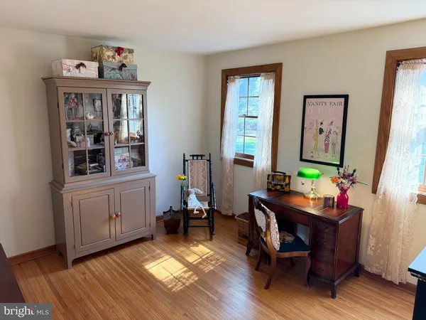 a bathroom with a toilet a sink and a mirror