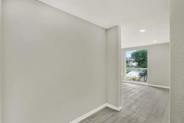 a view of an empty room and window