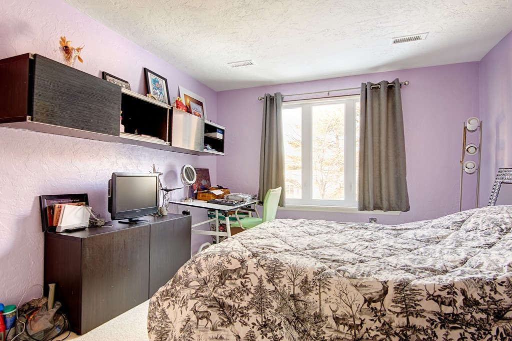 35 Cobblestone Lane, Unit 35 Worcester, MA 01606 - Photo 14 of 21 a bedroom with a bed and flat screen tv