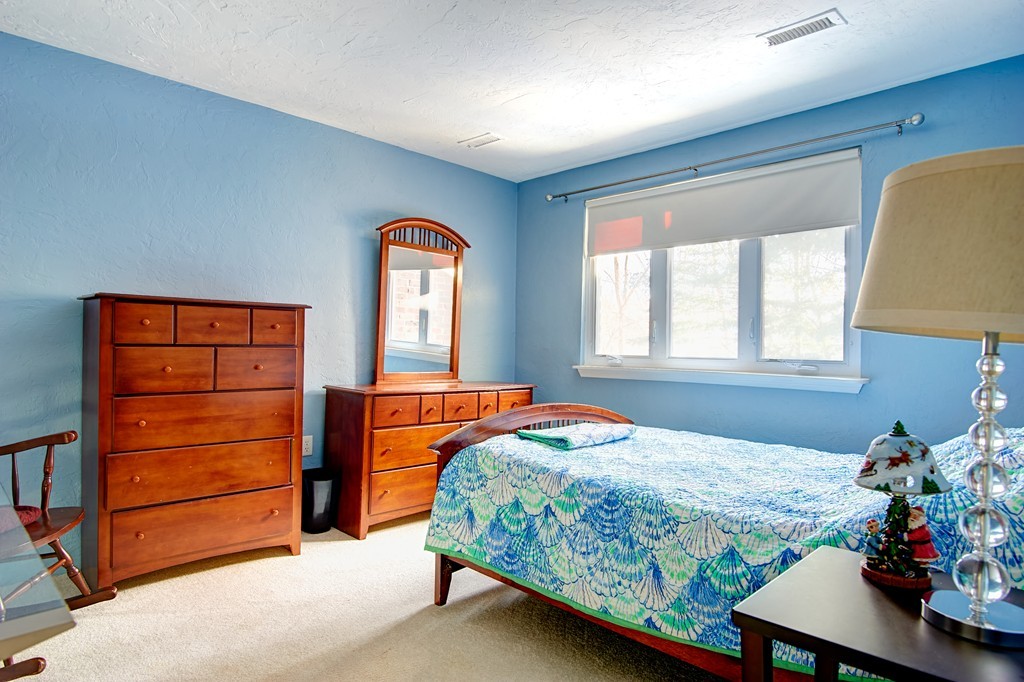 35 Cobblestone Lane, Unit 35 Worcester, MA 01606 - Photo 15 of 21 a bedroom with a bed and a dresser
