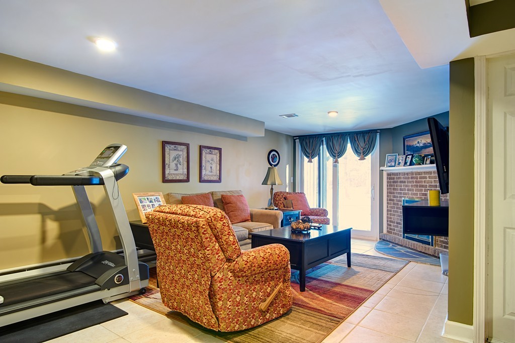 35 Cobblestone Lane, Unit 35 Worcester, MA 01606 - Photo 17 of 21 a living room with furniture and a flat screen tv