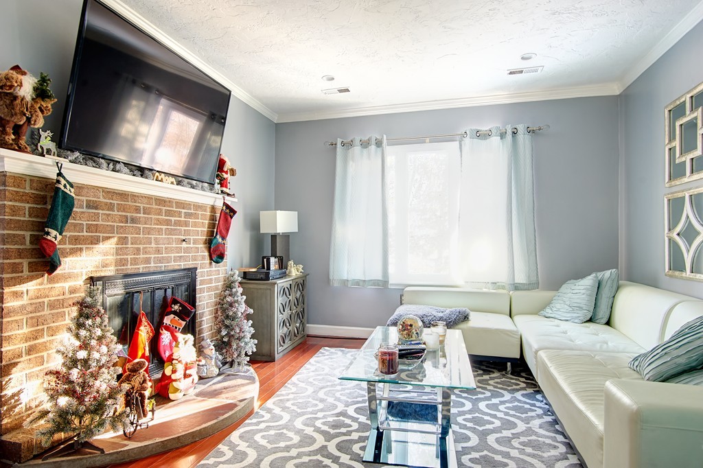 35 Cobblestone Lane, Unit 35 Worcester, MA 01606 - Photo 5 of 21 a living room with furniture and a flat screen tv