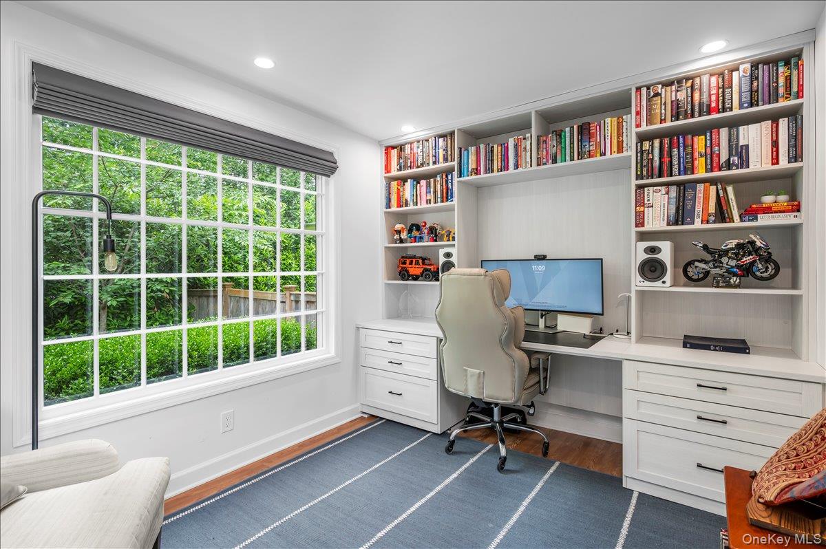 49 Eton Road Larchmont, NY 10538 - Photo 7 of 34 a view of a workspace with furniture and a bookshelf