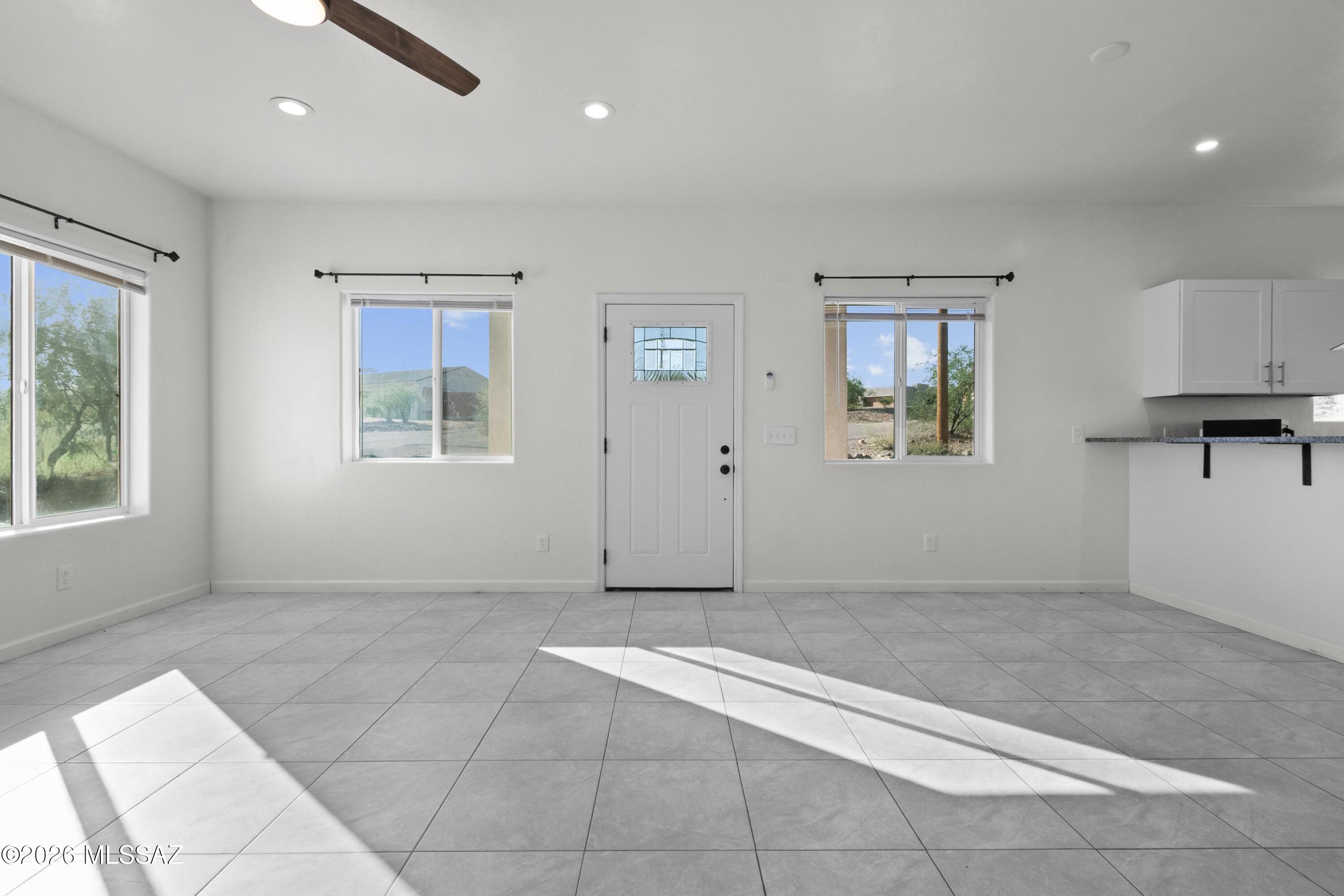 1785 Dove Court Rio Rico, AZ 85648 - Photo 6 of 31 a view of an empty room with a window