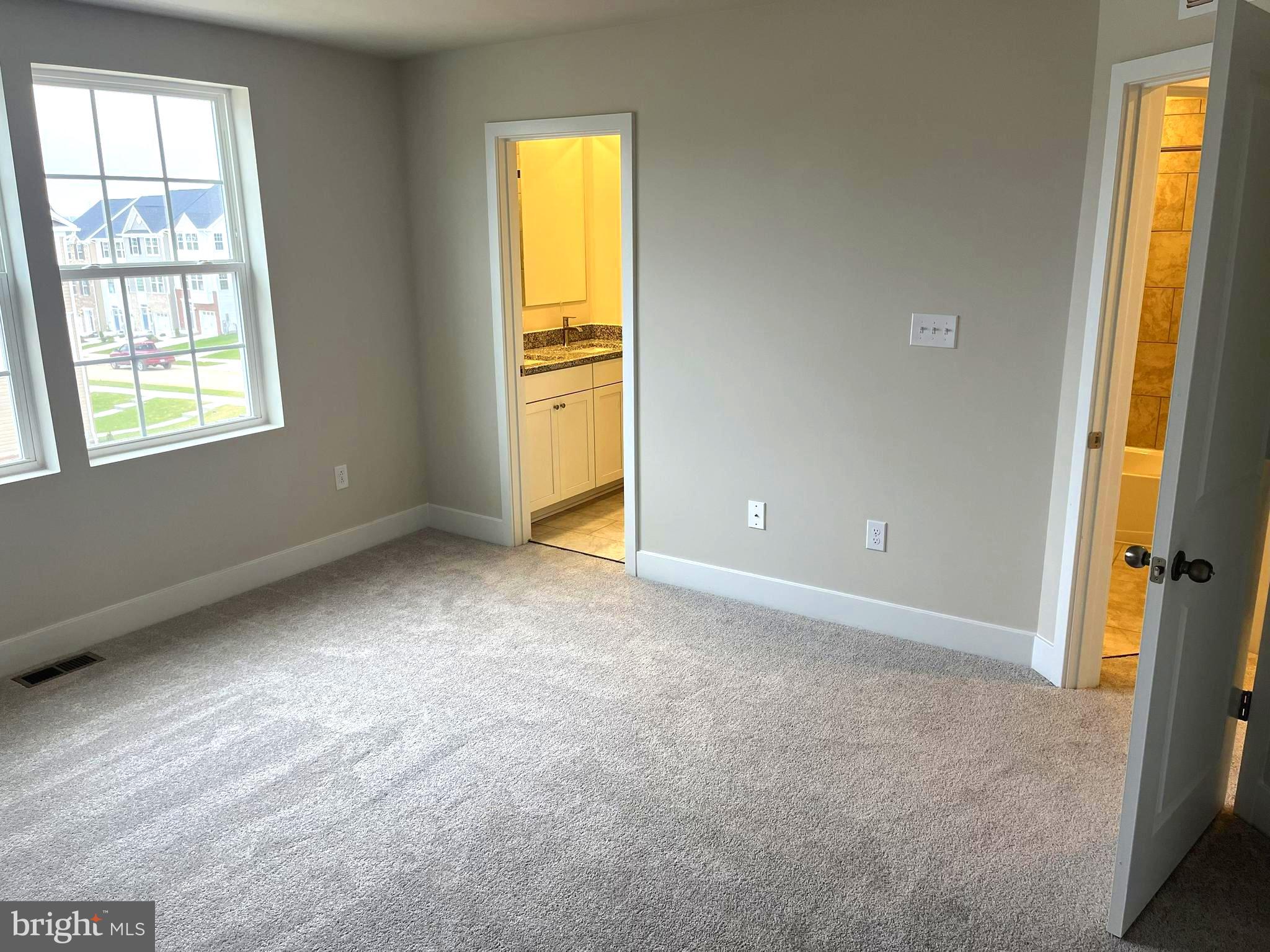 7618 Johnnycake Road Windsor Mill, MD 21244 - Photo 19 of 45 an empty room with windows and closet