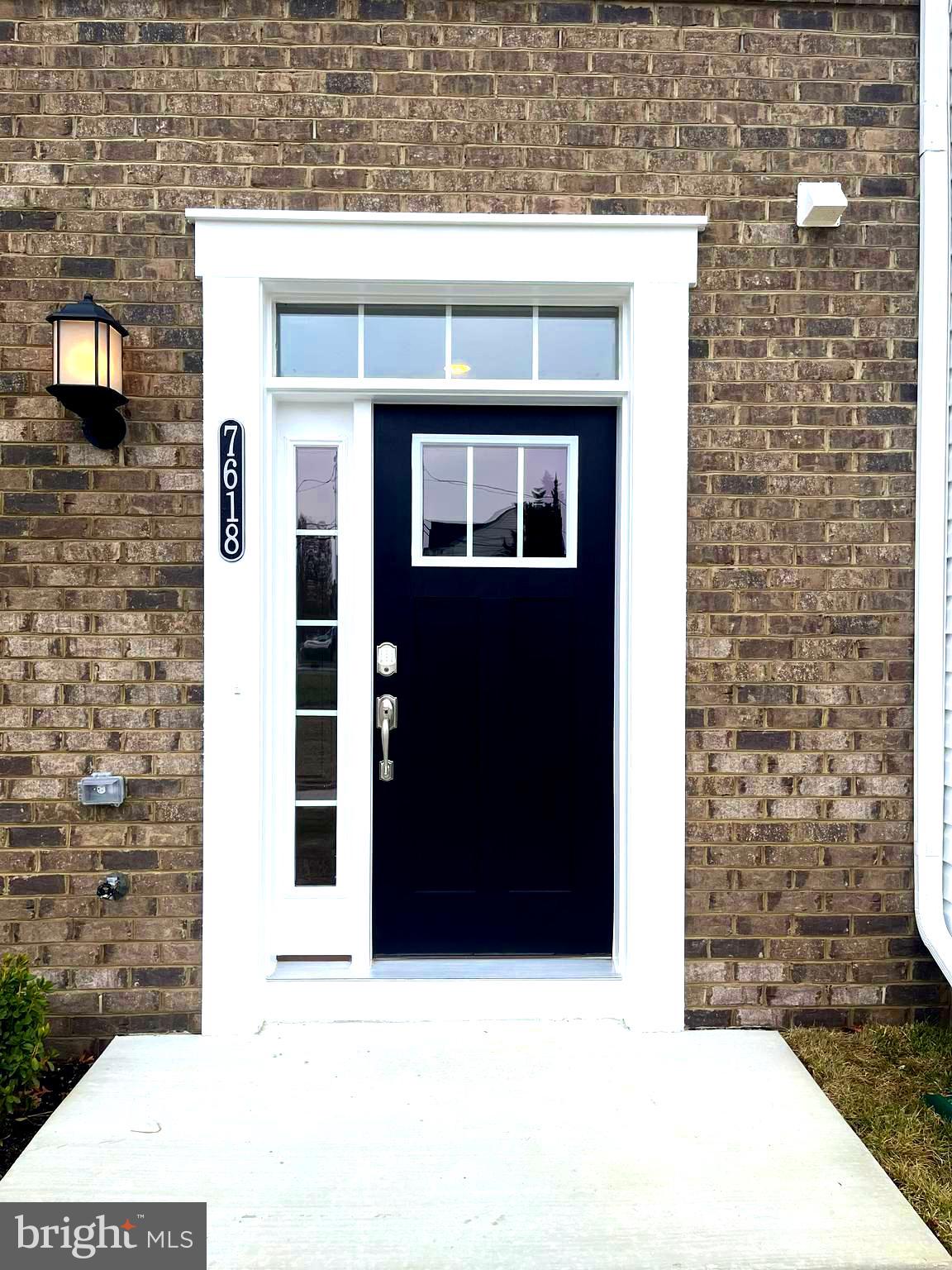 7618 Johnnycake Road Windsor Mill, MD 21244 - Photo 2 of 45 a black and white building with black door