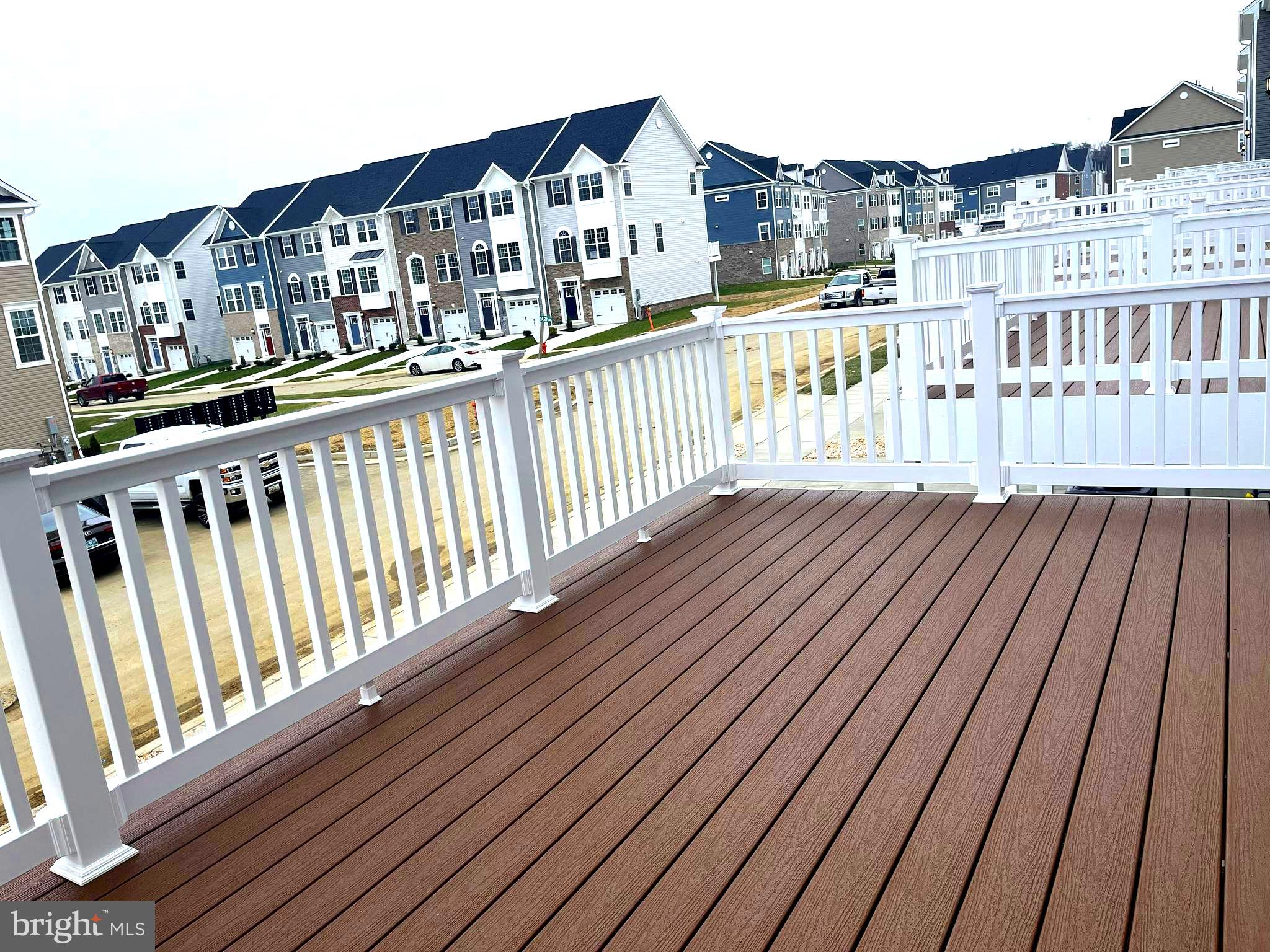 7618 Johnnycake Road Windsor Mill, MD 21244 - Photo 29 of 45 a view of balcony with wooden floor and fence