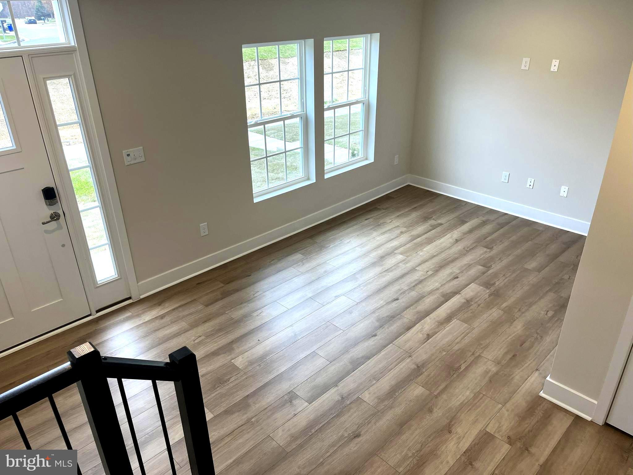 7618 Johnnycake Road Windsor Mill, MD 21244 - Photo 31 of 45 wooden floor in an empty room with a window