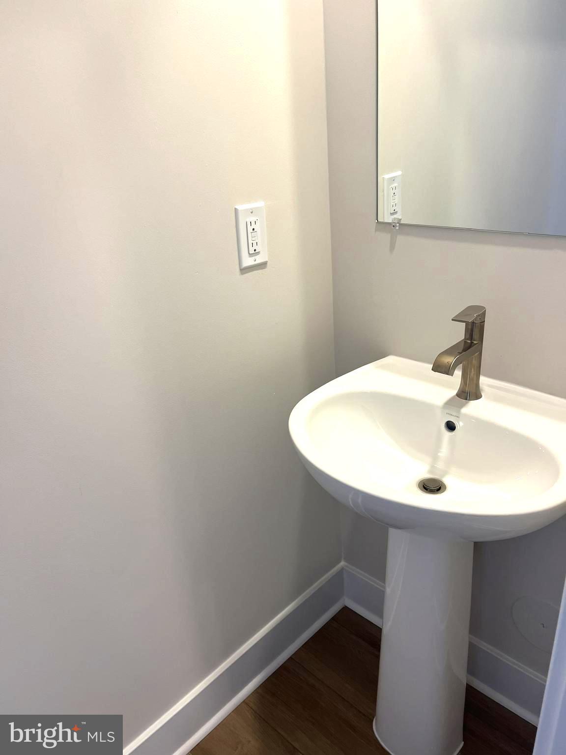 7618 Johnnycake Road Windsor Mill, MD 21244 - Photo 33 of 45 a bathroom with a sink and a mirror