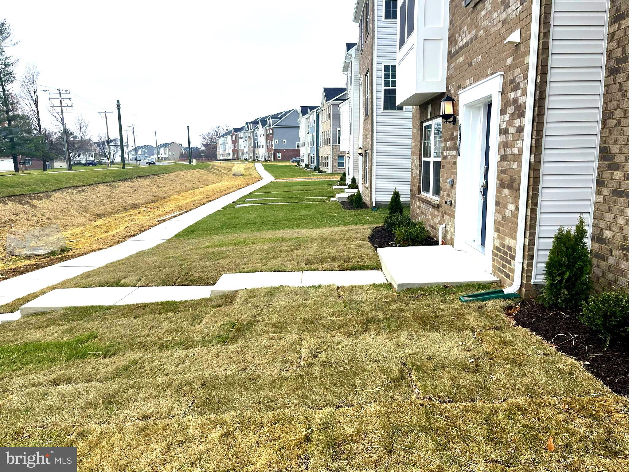 7618 Johnnycake Road Windsor Mill, MD 21244 - Photo 37 of 45 a view of a white apartments with large trees