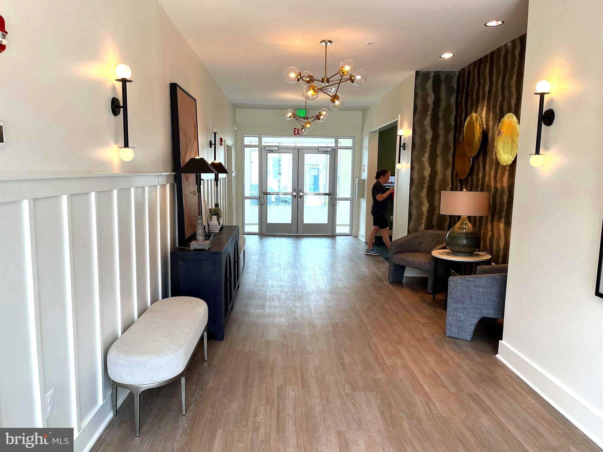 7618 Johnnycake Road Windsor Mill, MD 21244 - Photo 43 of 45 a lobby room with furniture and wooden floor