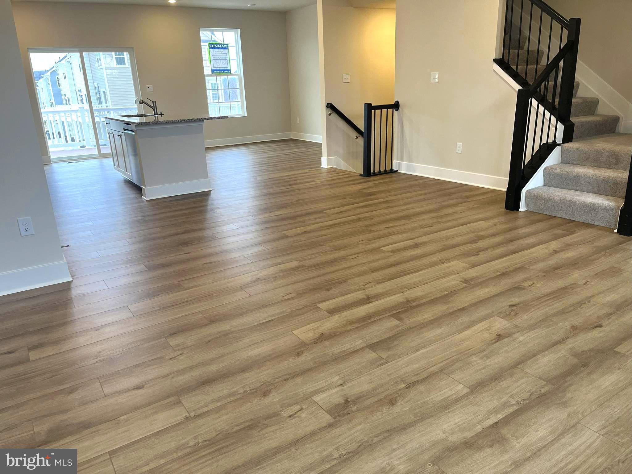 7618 Johnnycake Road Windsor Mill, MD 21244 - Photo 6 of 45 a view of a room with wooden floor and stairs