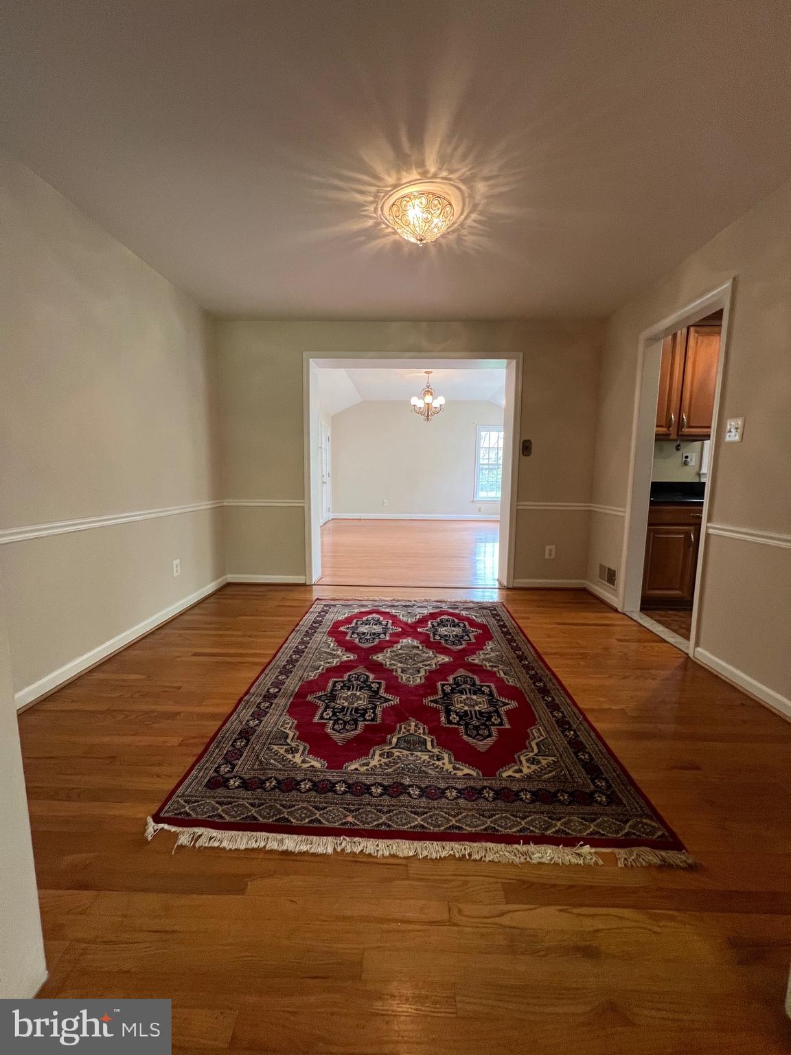 6825 Ridgeway Drive Springfield, VA 22150 - Photo 15 of 33 a view of a livingroom with wooden floor and a fireplace