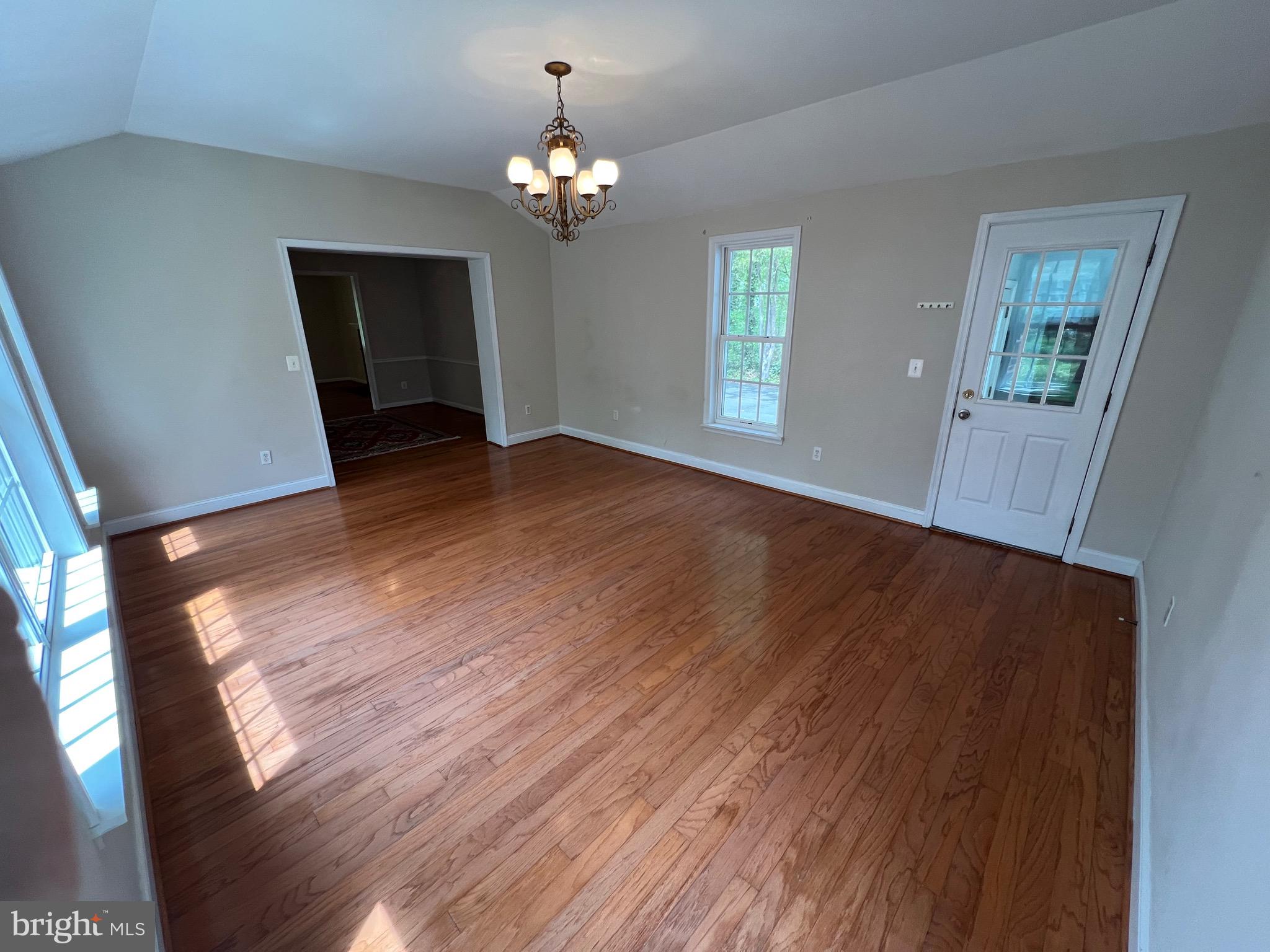 6825 Ridgeway Drive Springfield, VA 22150 - Photo 19 of 33 a view of an empty room with wooden floor and a window