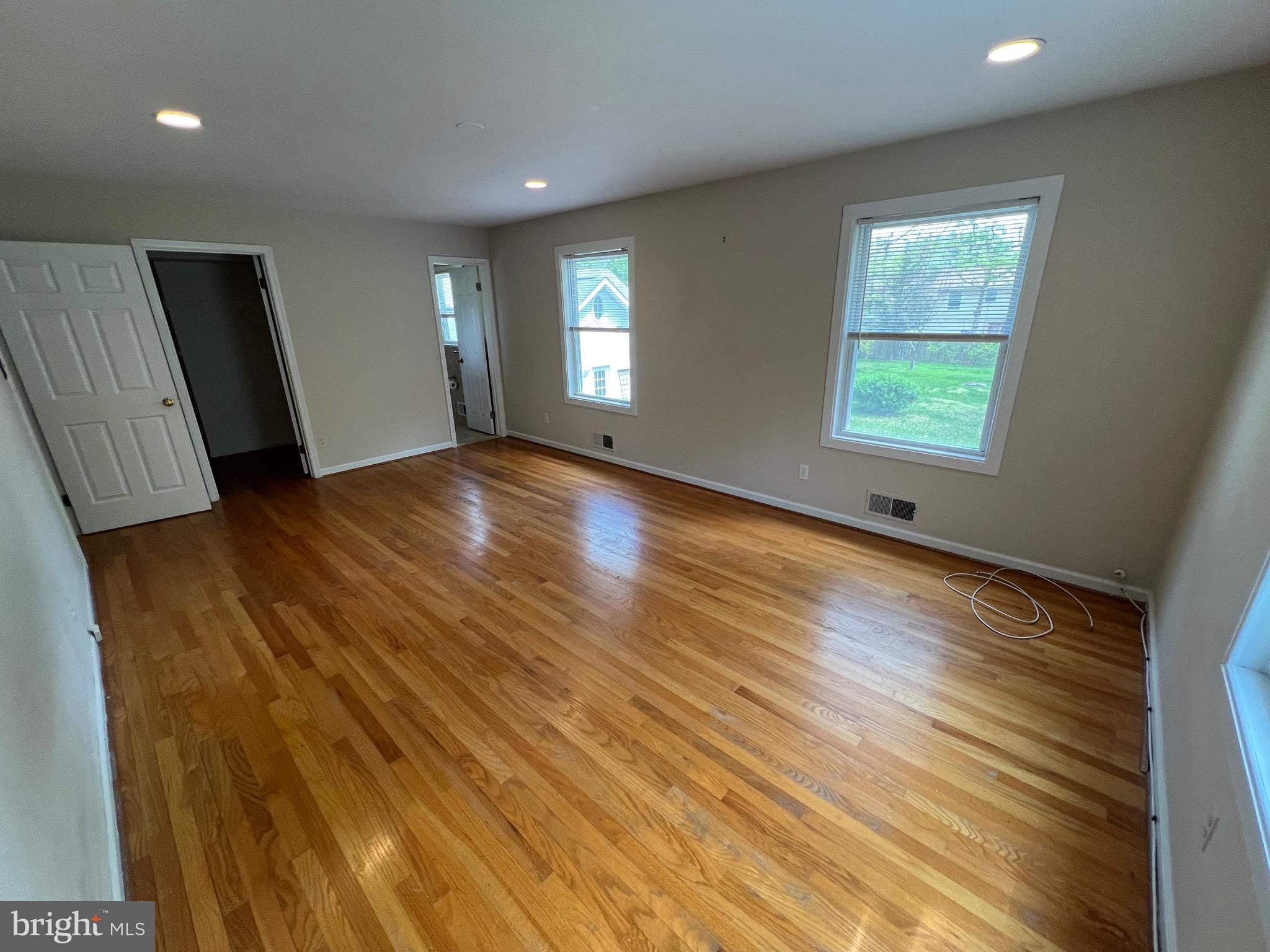 6825 Ridgeway Drive Springfield, VA 22150 - Photo 21 of 33 a view of an empty room with wooden floor and a window